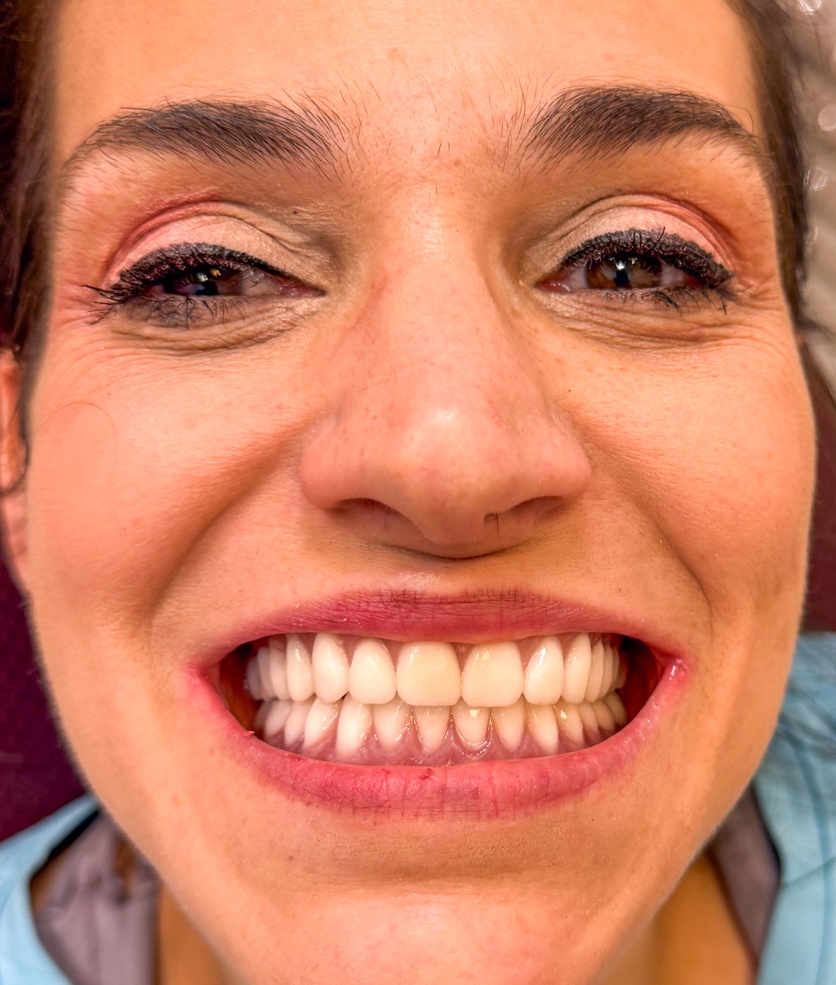 Adult smiling in natural light